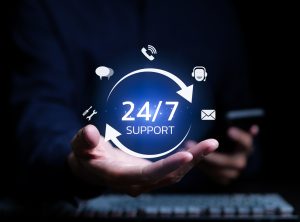 A man holding icon virtual 24/7 support services for worldwide nonstop and full-time available contact of service concept. Assistance customer services, Care and consulting client 24hr, Call Center,